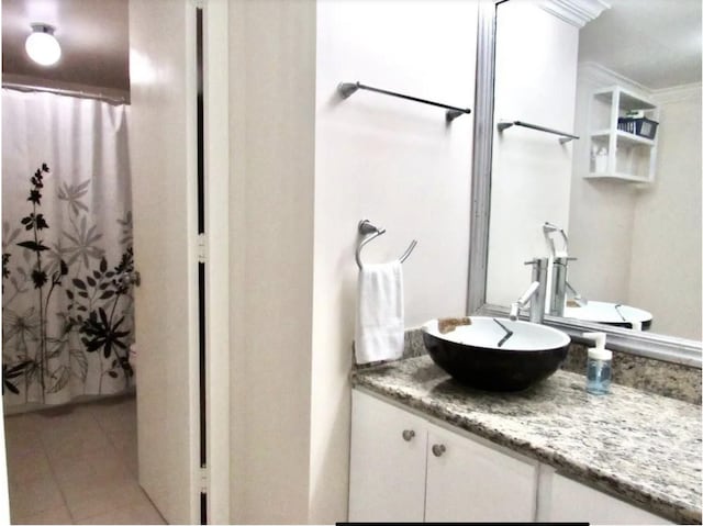 2016 Main St Unit 1505, Houston, TX 77002 - full bath featuring vanity, tile patterned flooring, and a shower with shower curtain