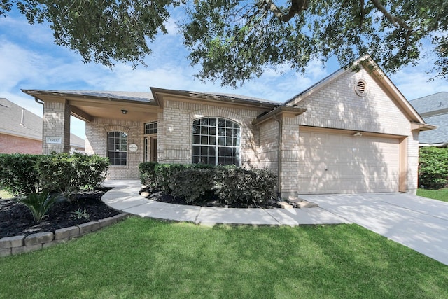 19130 Center Park Dr, Spring, TX 77373 - view of front facade with brick siding, a garage, driveway, and a front lawn