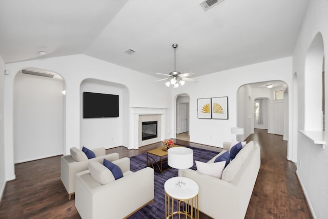 19130 Center Park Dr, Spring, TX 77373 - living room with arched walkways, wood finished floors, lofted ceiling, ceiling fan, and a tile fireplace