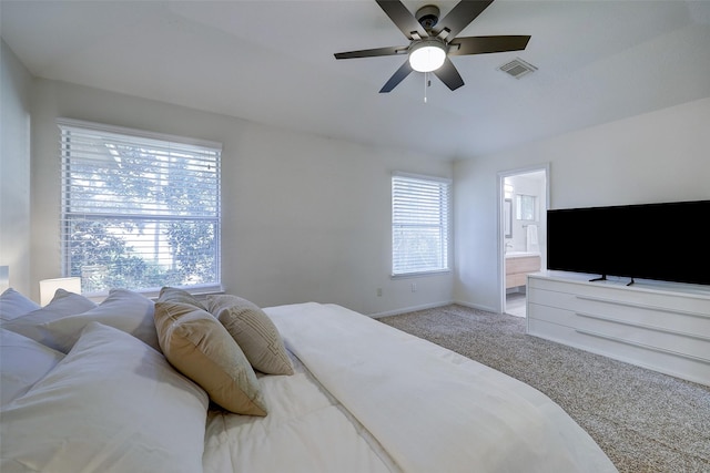 43 S Avonlea Cir, The Woodlands, TX 77382 - bedroom featuring carpet flooring, baseboards, ensuite bath, and a ceiling fan