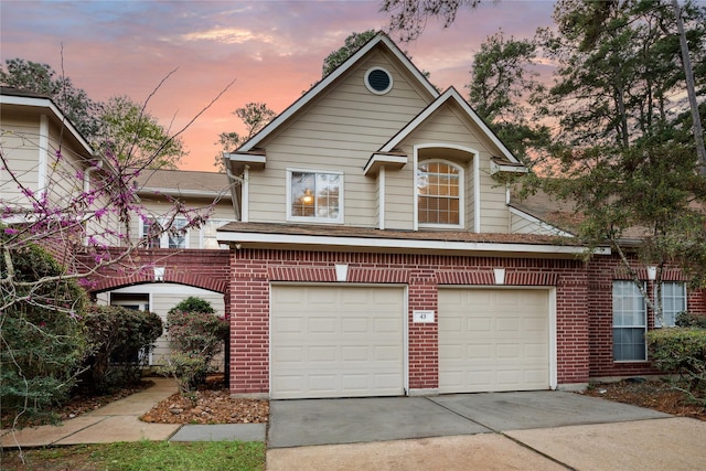 43 S Avonlea Cir, The Woodlands, TX 77382 - view of front of property featuring brick siding, concrete driveway, and an attached garage