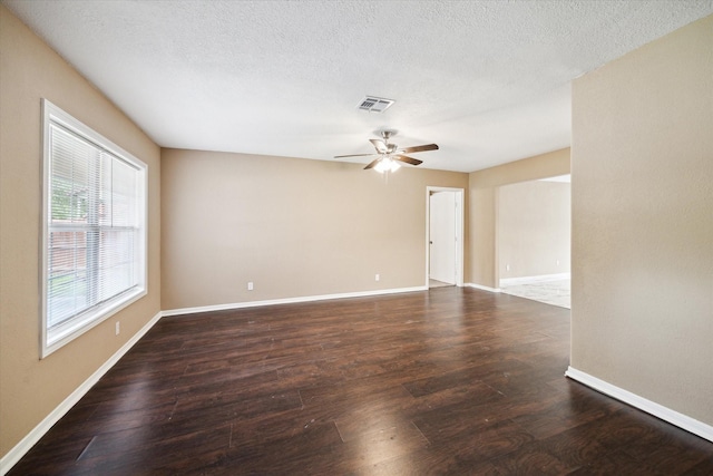 1904 Kansas St, Baytown, TX 77520 - unfurnished room with ceiling fan, wood finished floors, baseboards, and a textured ceiling