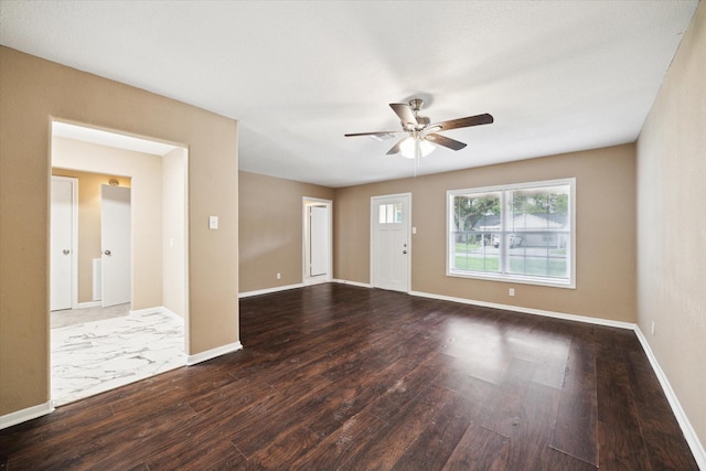 1904 Kansas St, Baytown, TX 77520 - unfurnished living room with ceiling fan, wood finished floors, and baseboards