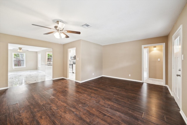 1904 Kansas St, Baytown, TX 77520 - unfurnished living room featuring a ceiling fan and wood finished floors