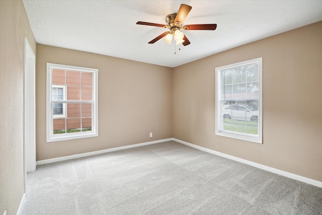 1904 Kansas St, Baytown, TX 77520 - carpeted spare room featuring baseboards and ceiling fan