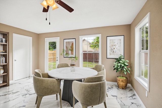 1904 Kansas St, Baytown, TX 77520 - dining area featuring light marble finish flooring and a ceiling fan