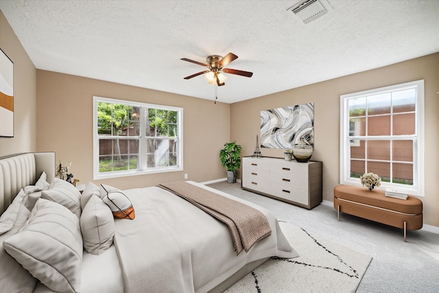 1904 Kansas St, Baytown, TX 77520 - bedroom with carpet, a textured ceiling, and ceiling fan