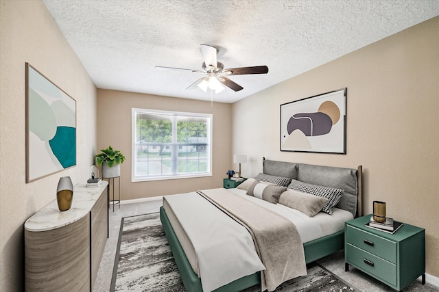 1904 Kansas St, Baytown, TX 77520 - bedroom with a textured ceiling, ceiling fan, and light carpet