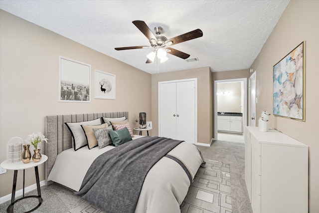 1904 Kansas St, Baytown, TX 77520 - bedroom featuring light colored carpet, a textured ceiling, a closet, and ceiling fan