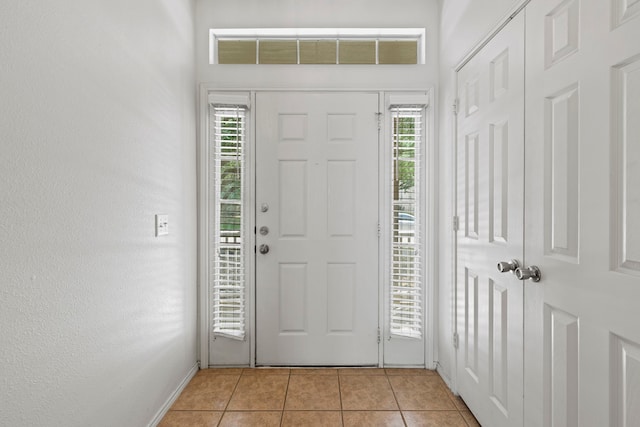 23831 Single Oak St, Spring, TX 77373 - entryway featuring light tile patterned flooring and baseboards