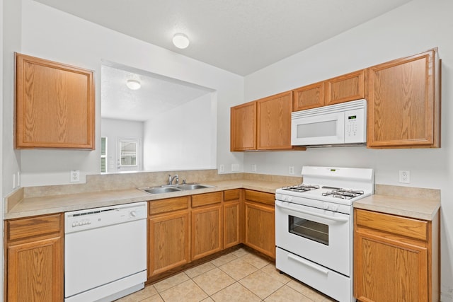 23831 Single Oak St, Spring, TX 77373 - kitchen featuring white appliances, a sink, light countertops, and light tile patterned flooring