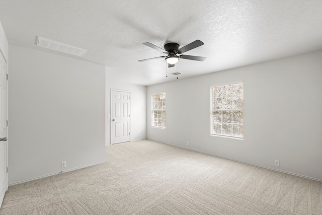 23831 Single Oak St, Spring, TX 77373 - spare room with carpet, a ceiling fan, a textured ceiling, and baseboards