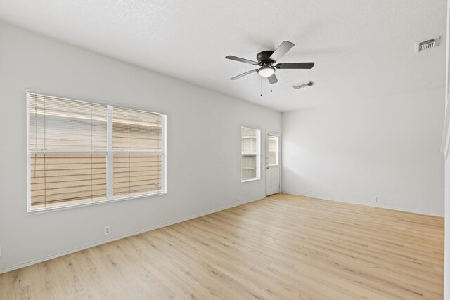 23831 Single Oak St, Spring, TX 77373 - empty room featuring light wood-style flooring, ceiling fan, and baseboards