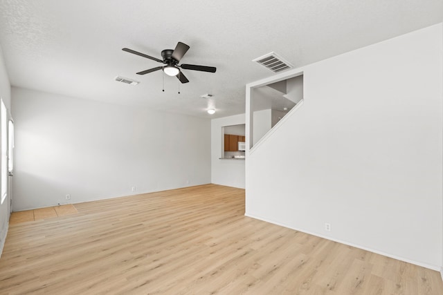 23831 Single Oak St, Spring, TX 77373 - unfurnished living room with light wood-style floors and a ceiling fan