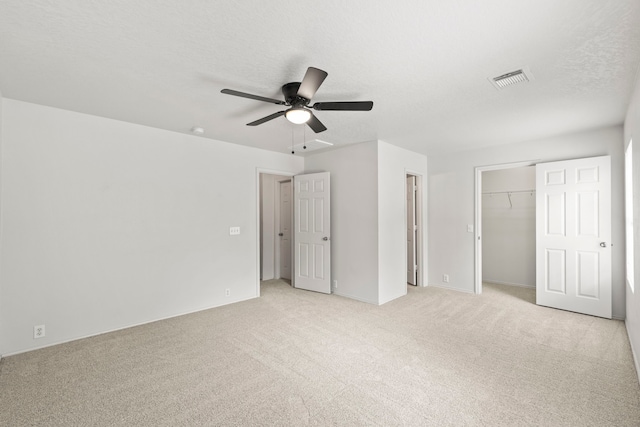 23831 Single Oak St, Spring, TX 77373 - unfurnished bedroom featuring light carpet, a closet, and a ceiling fan