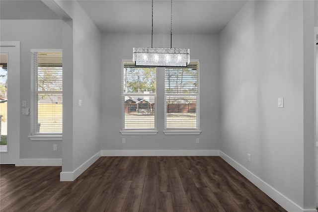 23826 Cow Oak Dr, Spring, TX 77389 - unfurnished dining area with plenty of natural light, dark wood-type flooring, and baseboards