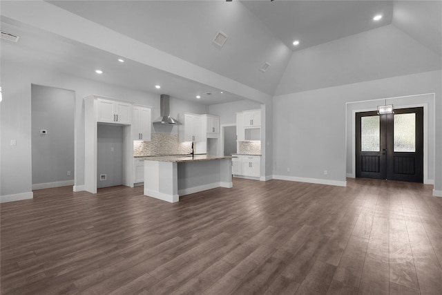 23826 Cow Oak Dr, Spring, TX 77389 - unfurnished living room with recessed lighting, high vaulted ceiling, dark wood finished floors, baseboards, and french doors