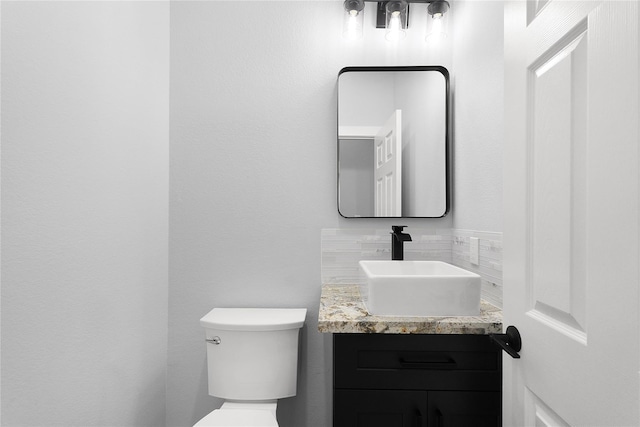 23826 Cow Oak Dr, Spring, TX 77389 - half bathroom with tasteful backsplash, toilet, and vanity