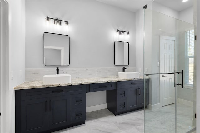 23826 Cow Oak Dr, Spring, TX 77389 - full bathroom featuring double vanity, a shower stall, marble look tile flooring, and baseboards