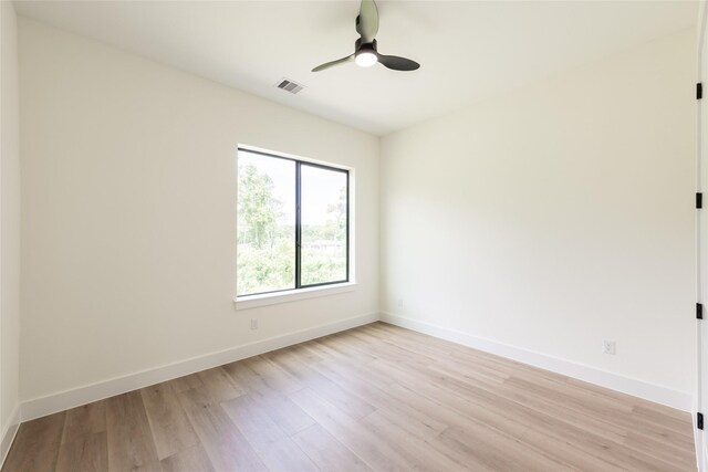 6135 Pacific Forest Dr, Houston, TX 77346 - empty room featuring light wood finished floors, baseboards, and ceiling fan