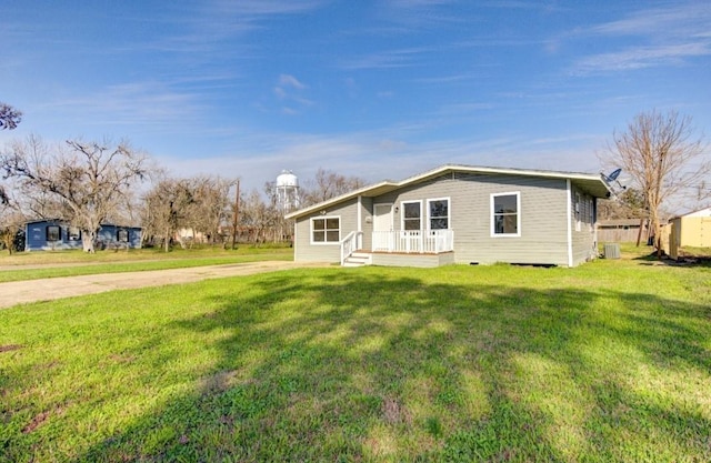 51 Blue Bonnet Ct, Lake Jackson, TX 77566 - view of front of house with central AC unit and a front yard