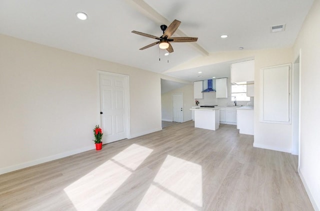 51 Blue Bonnet Ct, Lake Jackson, TX 77566 - unfurnished living room with light wood-type flooring, ceiling fan, a sink, baseboards, and recessed lighting