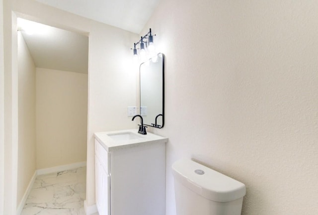51 Blue Bonnet Ct, Lake Jackson, TX 77566 - bathroom with vanity, marble look tile flooring, toilet, and baseboards