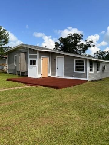 51 Blue Bonnet Ct, Lake Jackson, TX 77566 - view of front facade featuring a front lawn and a wooden deck