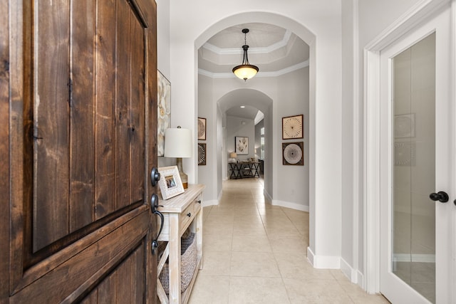 511 Summer Acres Ct, Rosenberg, TX 77469 - corridor with arched walkways, a tray ceiling, light tile patterned floors, baseboards, and ornamental molding