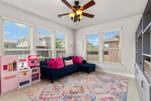 511 Summer Acres Ct, Rosenberg, TX 77469 - living room with light tile patterned floors, ceiling fan, and baseboards