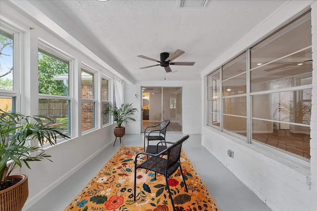 9863 Swan Ct, Conroe, TX 77385 - sunroom featuring a ceiling fan, concrete flooring, and a textured ceiling