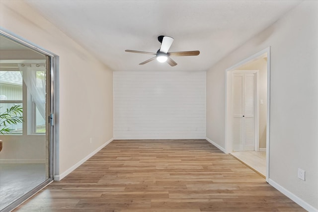 9863 Swan Ct, Conroe, TX 77385 - unfurnished room with a ceiling fan, light wood finished floors, and baseboards