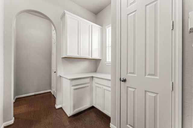 32039 Autumn Orchard Ln, Conroe, TX 77385 - hall with dark wood finished floors, arched walkways, and baseboards