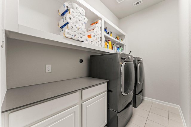 32039 Autumn Orchard Ln, Conroe, TX 77385 - laundry room featuring washing machine and clothes dryer, light tile patterned floors, and baseboards