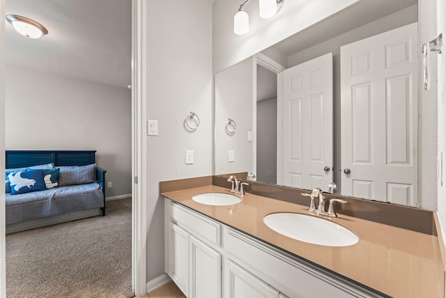 32039 Autumn Orchard Ln, Conroe, TX 77385 - ensuite bathroom with double vanity and baseboards