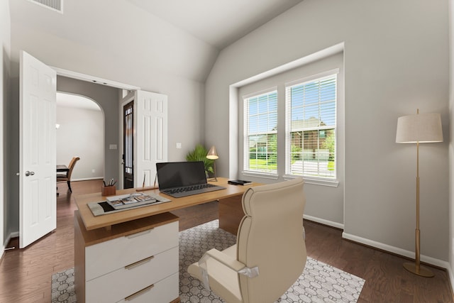 32039 Autumn Orchard Ln, Conroe, TX 77385 - office area featuring dark wood-type flooring, baseboards, arched walkways, and vaulted ceiling