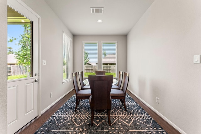 32039 Autumn Orchard Ln, Conroe, TX 77385 - dining area with dark wood finished floors and baseboards