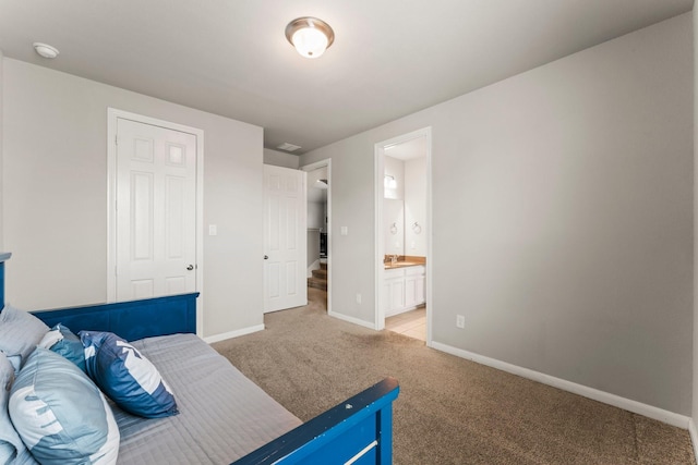32039 Autumn Orchard Ln, Conroe, TX 77385 - bedroom featuring light carpet, baseboards, and connected bathroom