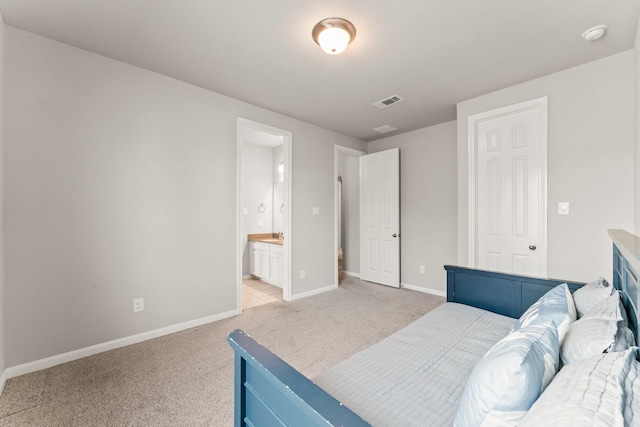 32039 Autumn Orchard Ln, Conroe, TX 77385 - bedroom featuring light colored carpet, baseboards, and connected bathroom