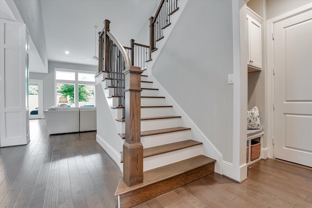 107 E Sawyer Ridge Dr, Spring, TX 77389 - stairway featuring wood finished floors, ceiling fan, recessed lighting, and baseboards
