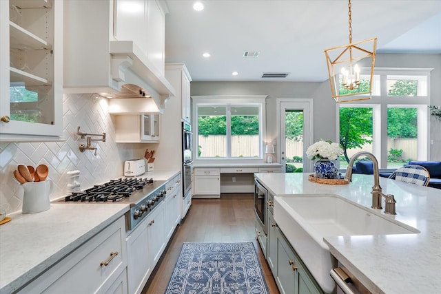 107 E Sawyer Ridge Dr, Spring, TX 77389 - kitchen featuring appliances with stainless steel finishes, white cabinetry, healthy amount of natural light, and recessed lighting