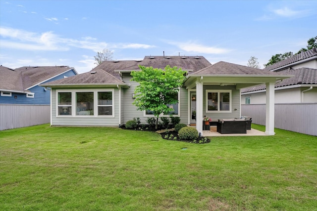 107 E Sawyer Ridge Dr, Spring, TX 77389 - rear view of house featuring outdoor lounge area, a patio, and a shingled roof