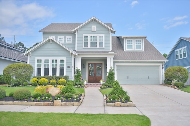 107 E Sawyer Ridge Dr, Spring, TX 77389 - view of front of house with driveway, french doors, and roof with shingles