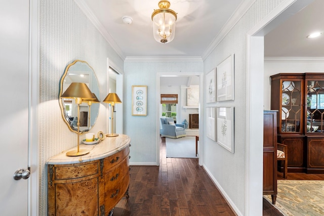 8015 Skyline Dr, Houston, TX 77063 - hall featuring dark wood finished floors, ornamental molding, wallpapered walls, and baseboards