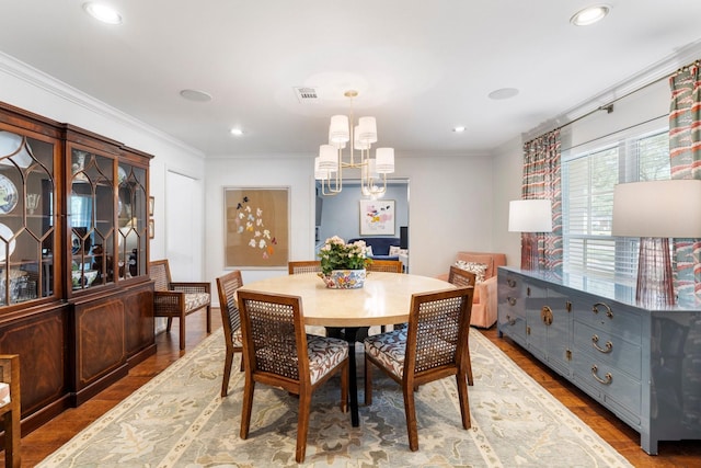 8015 Skyline Dr, Houston, TX 77063 - dining area with crown molding, a chandelier, wood finished floors, and recessed lighting