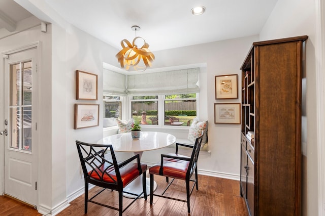8015 Skyline Dr, Houston, TX 77063 - dining area with dark wood-style flooring, baseboards, a chandelier, and recessed lighting