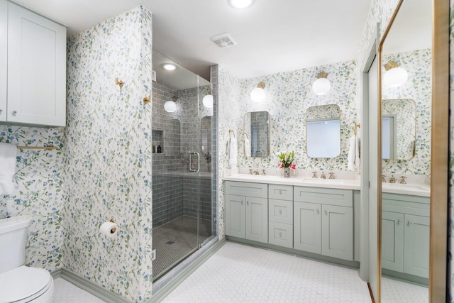 8015 Skyline Dr, Houston, TX 77063 - bathroom featuring wallpapered walls, a stall shower, toilet, double vanity, and tile patterned floors