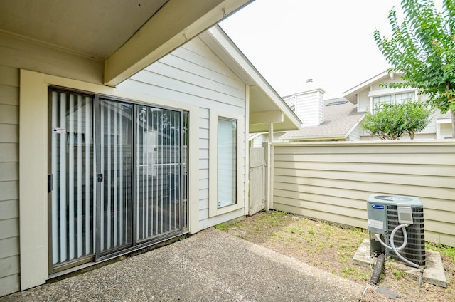 6211 Ludington Dr Unit 21-909, Houston, TX 77035 - doorway to property with central AC unit