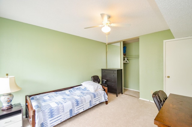 6211 Ludington Dr Unit 21-909, Houston, TX 77035 - bedroom with light colored carpet, a closet, ceiling fan, and baseboards