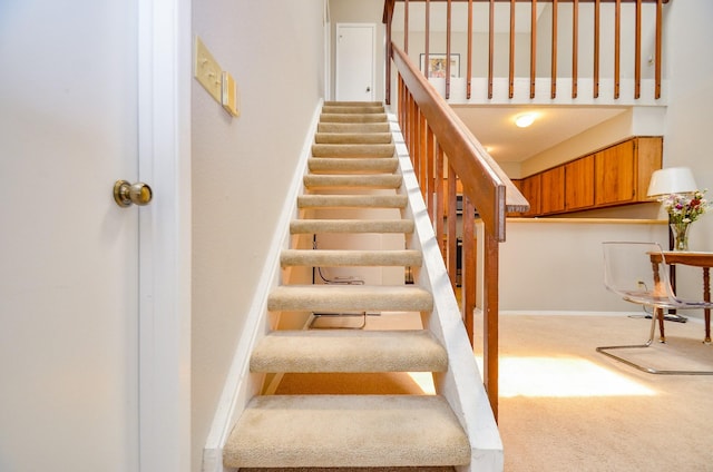 6211 Ludington Dr Unit 21-909, Houston, TX 77035 - staircase with carpet floors, baseboards, and a high ceiling